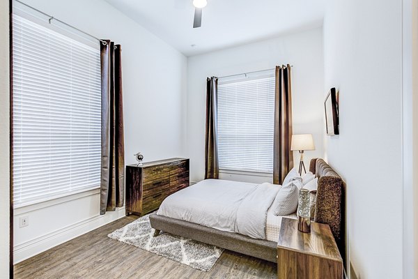 Modern bedroom with stylish decor at Elan Inwood Apartments, known for luxury living and contemporary design in the heart of the community