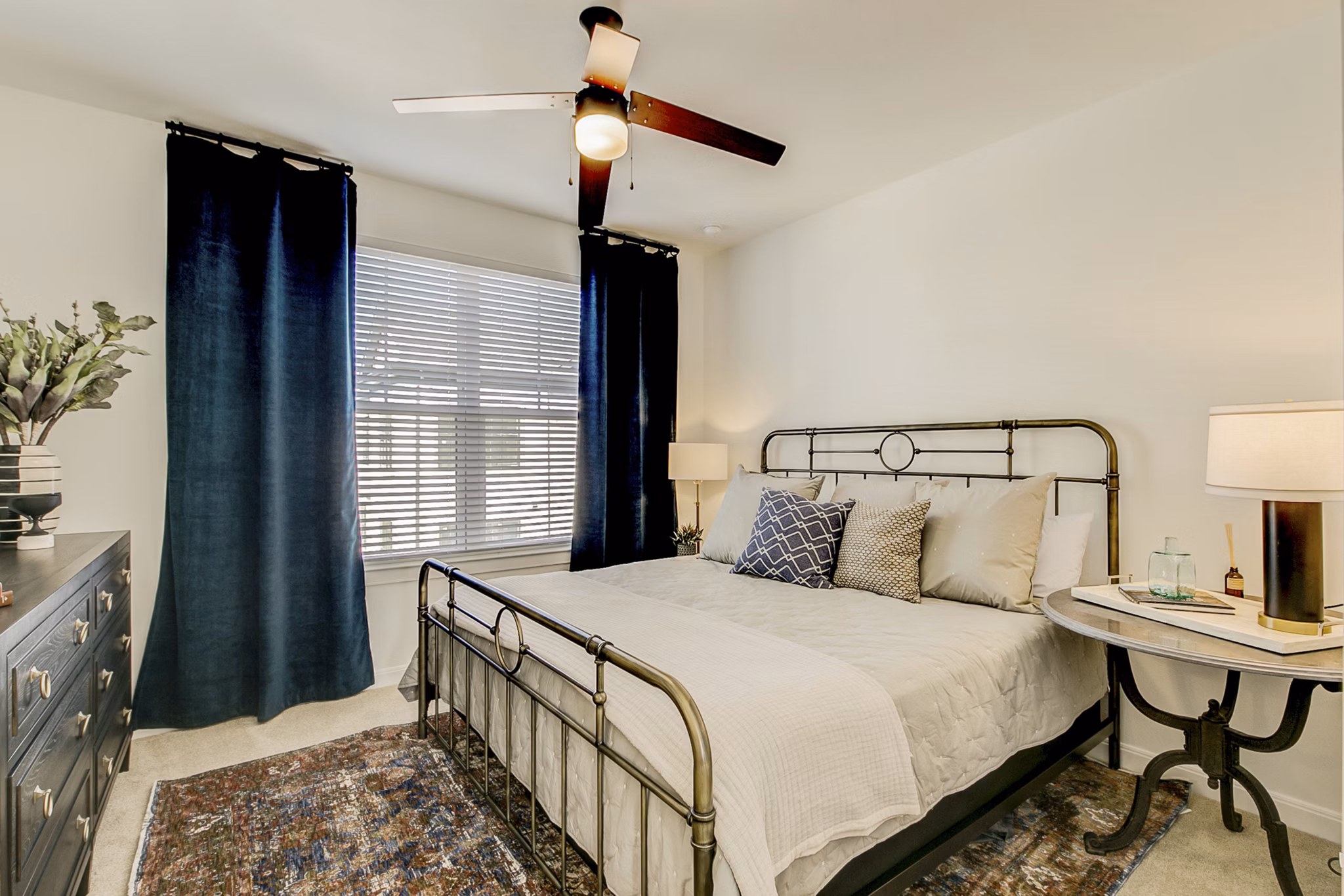 Modern bedroom with large windows in Elan Inwood Apartments