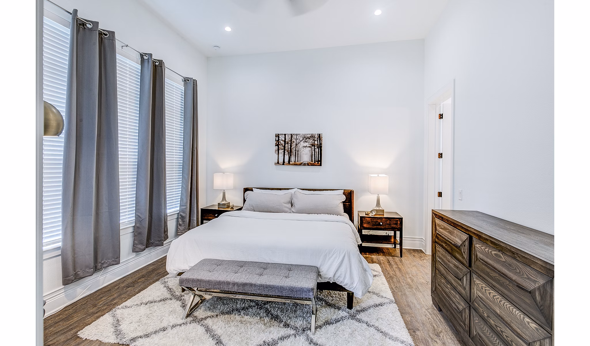 Bedroom with modern decor and natural light at Elan Inwood Apartments