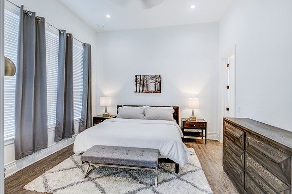 Bedroom with modern decor and natural light at Elan Inwood Apartments