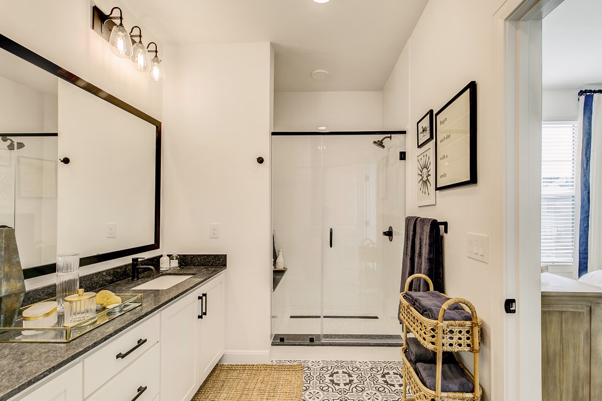 Modern bathroom with sleek fixtures and marble countertops in Elan Inwood Apartments
