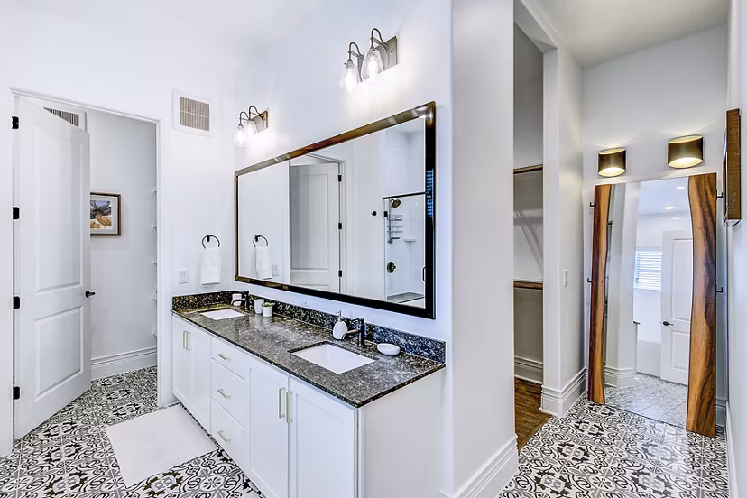 Modern bathroom with sleek fixtures and granite countertops at Elan Inwood Apartments