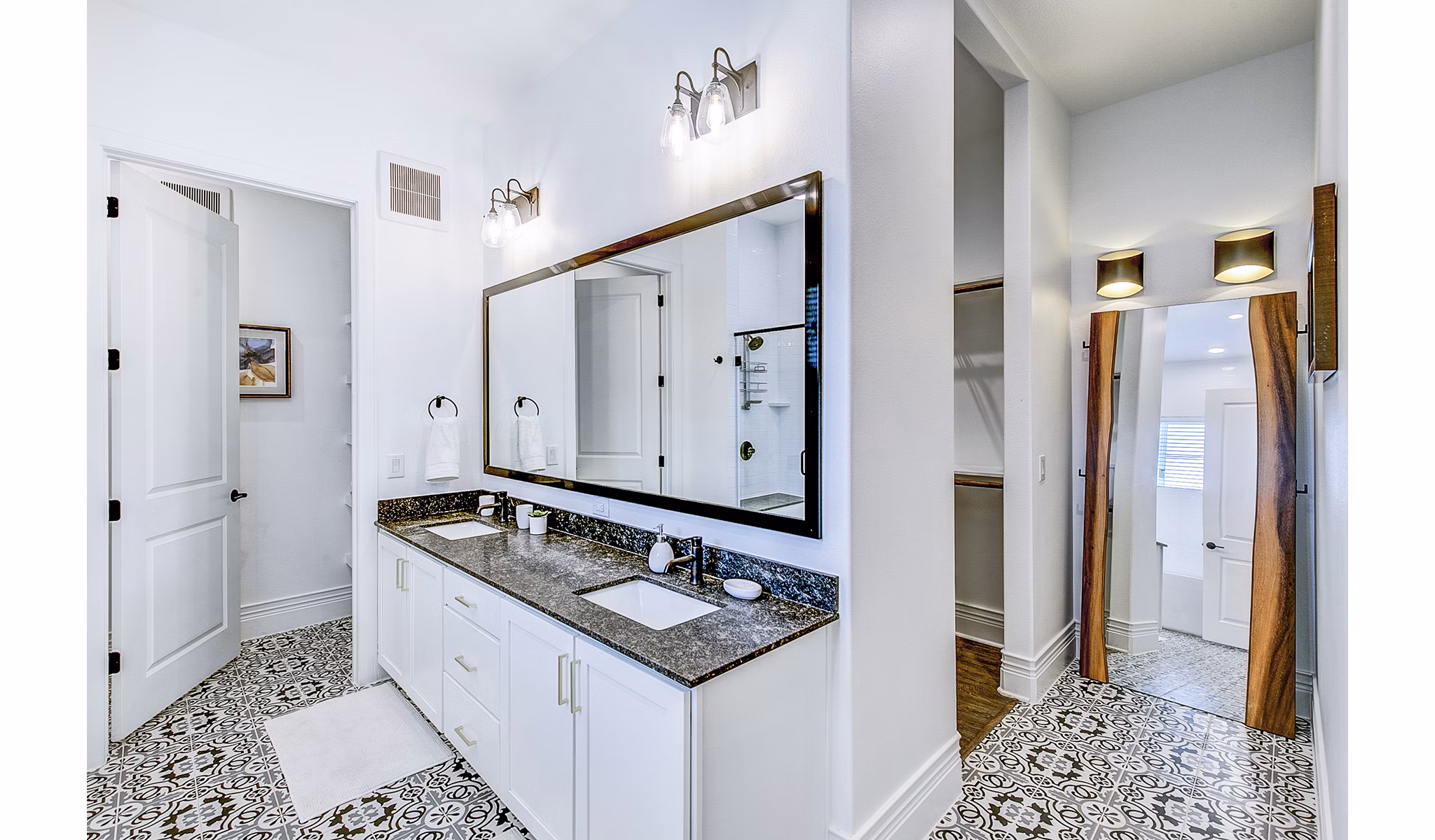 Modern bathroom with sleek fixtures and granite countertops at Elan Inwood Apartments