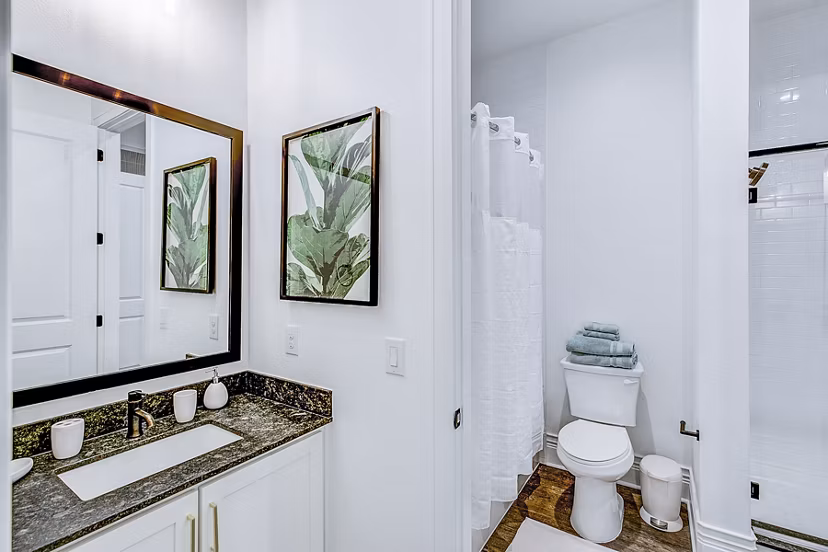 Modern bathroom with sleek fixtures and marble tile at Elan Inwood Apartments, Dallas Luxury amenities enhance your living experience