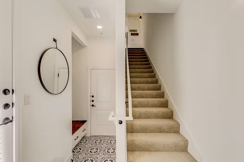 Elegant hallway with contemporary lighting fixtures at Elan Inwood Apartments