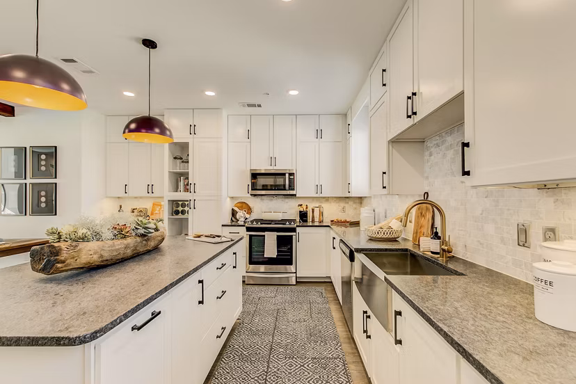 Modern kitchen with stainless steel appliances at Elan Inwood Apartments