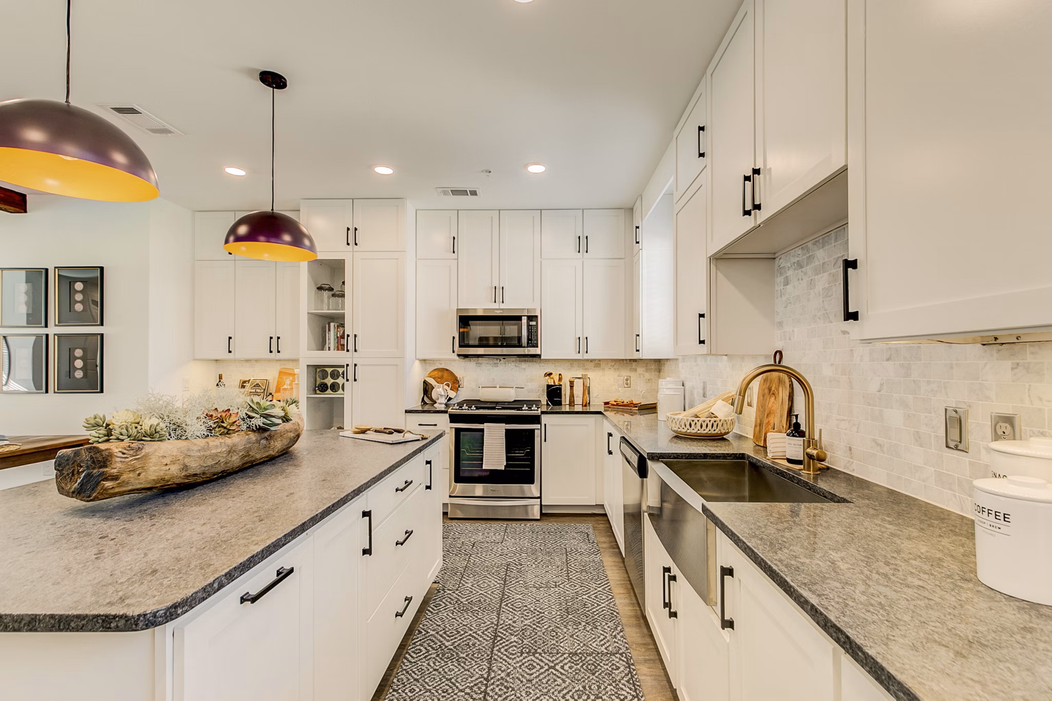 Modern kitchen with stainless steel appliances at Elan Inwood Apartments