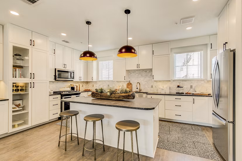 Modern kitchen with stainless steel appliances and granite countertops at Elan Inwood Apartments Perfect for cooking enthusiasts and hosting guests
