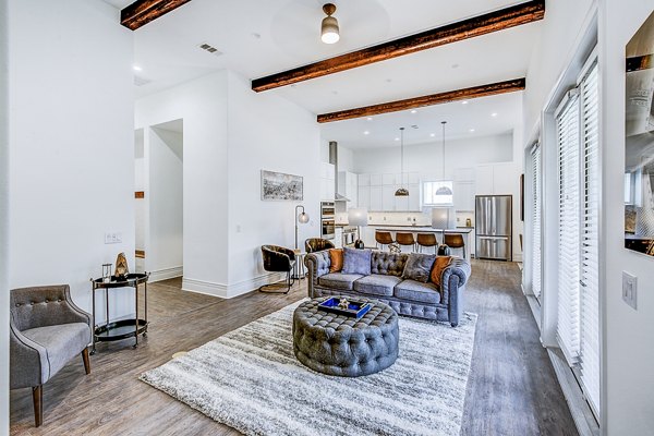 Modern living room with sleek furnishings in Elan Inwood Apartments, showcasing luxury living near Greystar property options