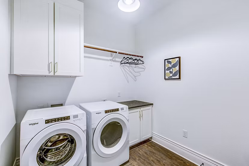 Laundry room with modern appliances at Elan Inwood Apartments