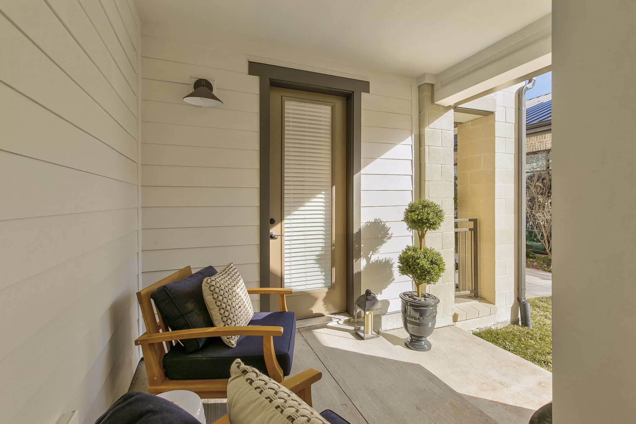Modern outdoor patio with stylish seating at Elan Inwood Apartments