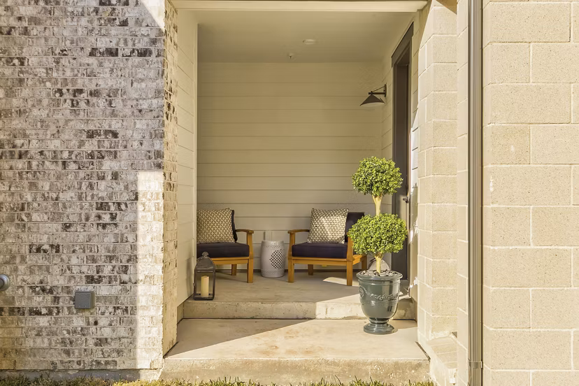 Spacious outdoor patio area with modern seating at Elan Inwood Apartments, offering residents a comfortable space to relax and entertain