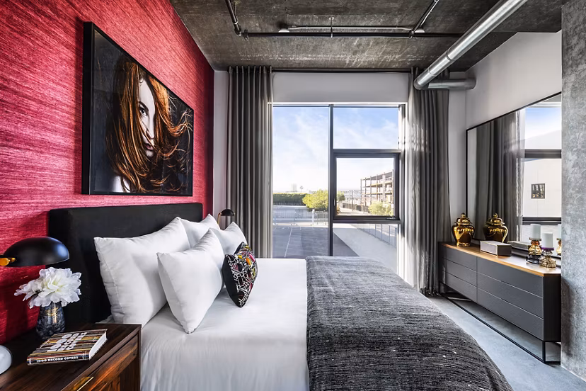 Cozy bedroom with modern decor at AMP Lofts Apartments