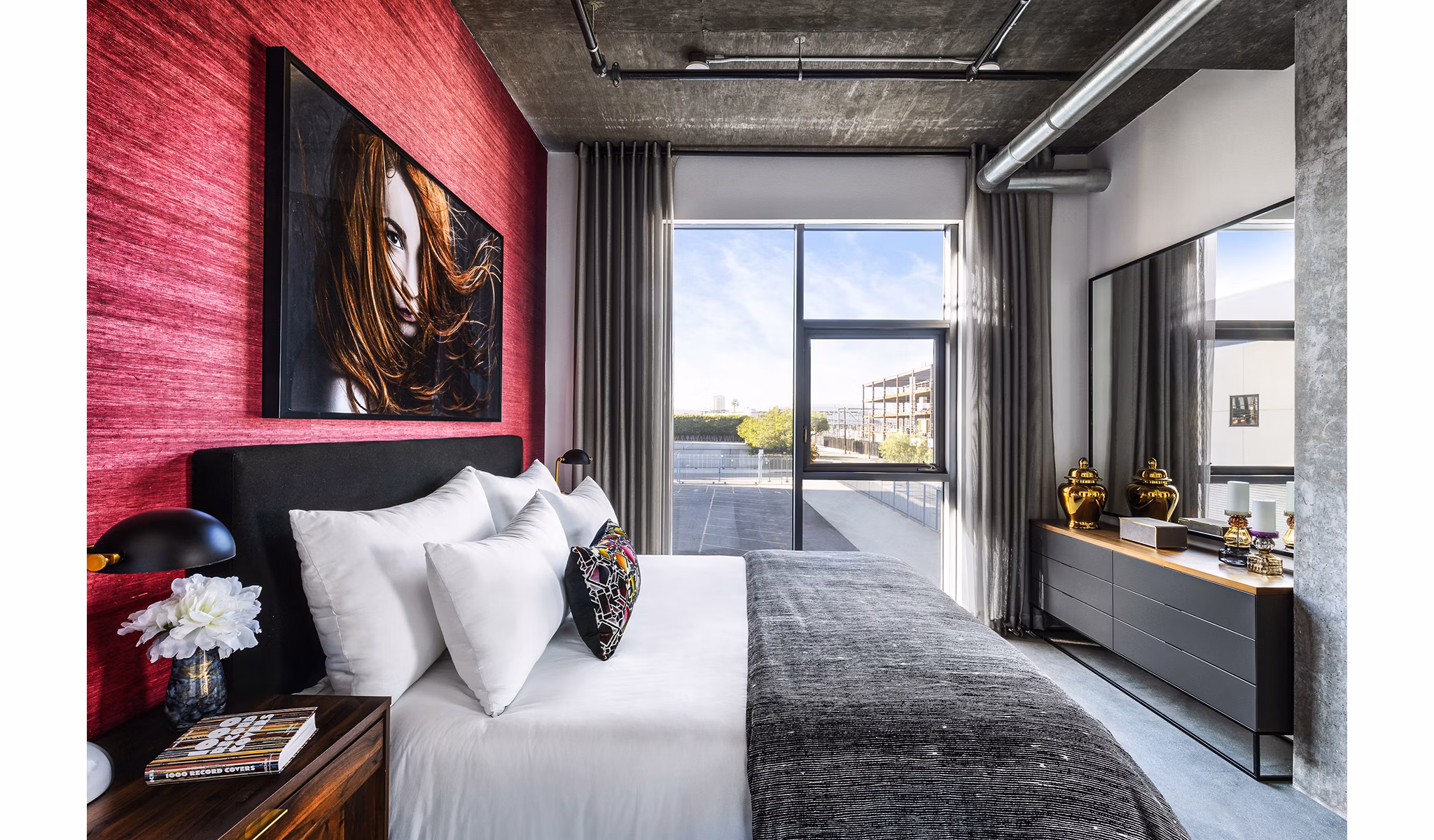 Cozy bedroom with modern decor at AMP Lofts Apartments