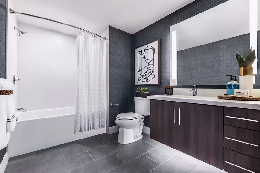 Modern bathroom with sleek fixtures and spacious layout at AMP Lofts Apartments