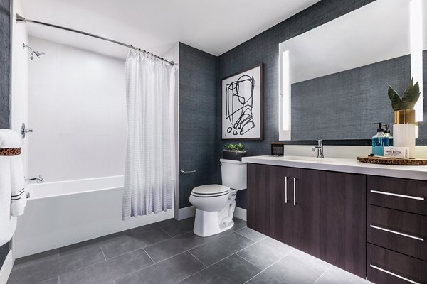 Modern bathroom with sleek fixtures and spacious layout at AMP Lofts Apartments