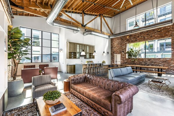 Clubhouse lobby with modern decor and seating options at AMP Lofts Apartments