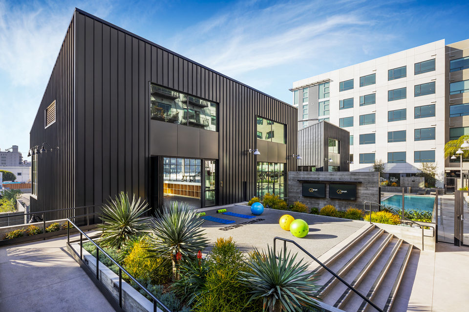 Yoga/spin studio equipped with modern equipment at AMP Lofts Apartments for fitness enthusiasts