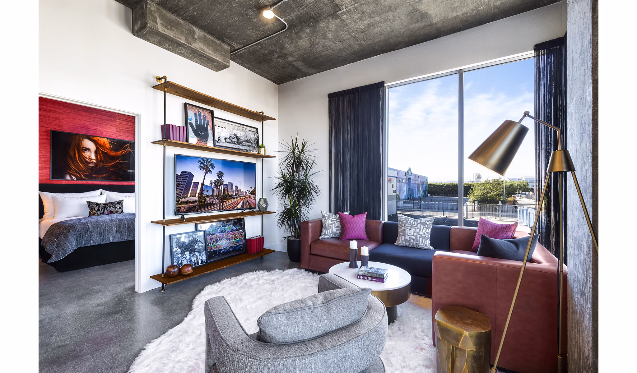 Spacious living room with modern decor in AMP Lofts Apartments, offering luxury living in a vibrant community