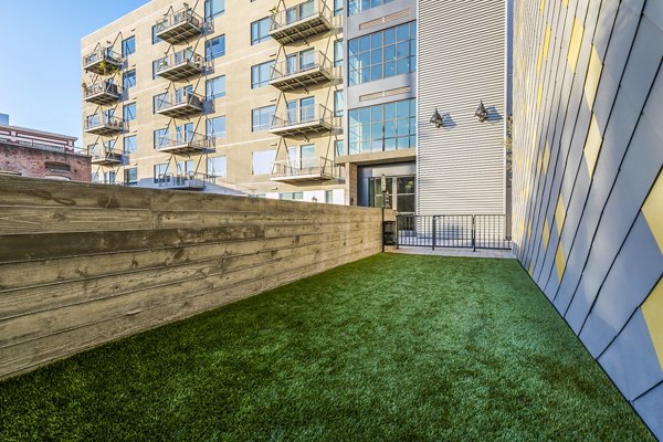 Dog park with pet-friendly features at AMP Lofts Apartments