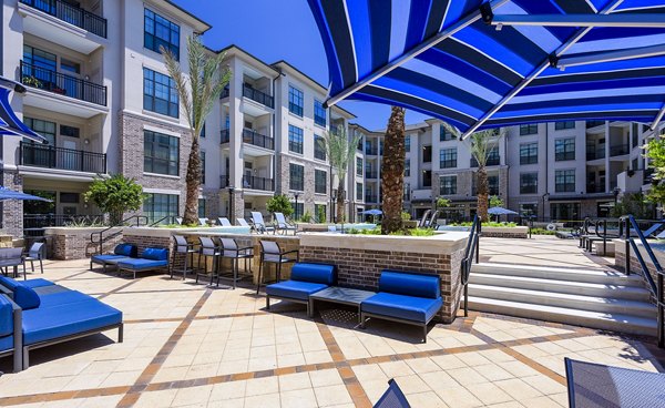 grill area at Arlo Westchase Apartments                                                     