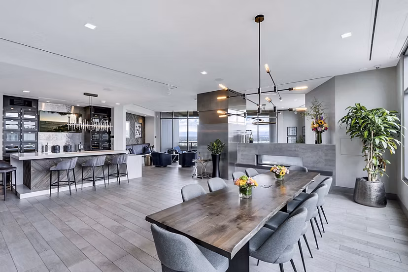Open-concept living and dining area with modern kitchen at Parq on Speer Apartments, luxury living in Denver