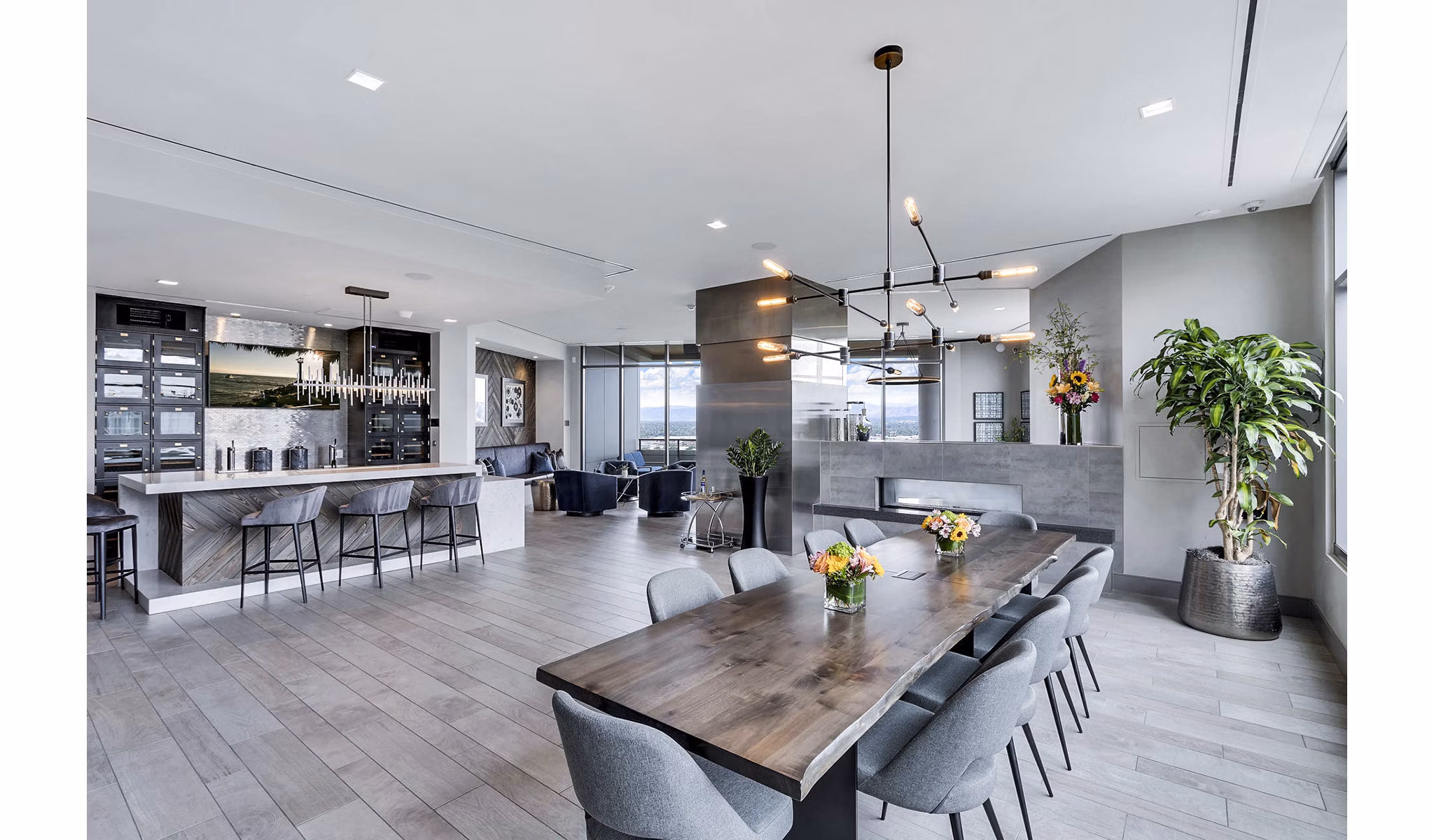Open-concept living and dining area with modern kitchen at Parq on Speer Apartments, luxury living in Denver