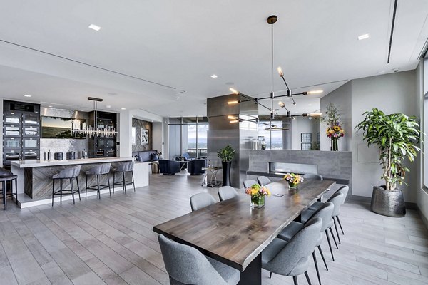 Open-concept living and dining area with modern kitchen at Parq on Speer Apartments, luxury living in Denver