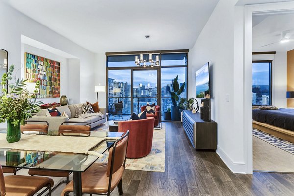 Stylish living room and bedroom with city views at Parq on Speer luxury apartments in Denver