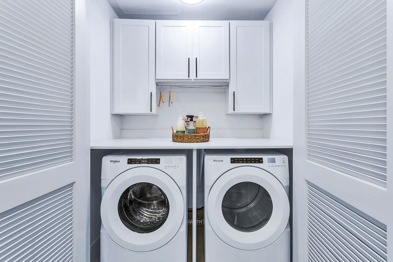 Laundry room at Parq On Speer Apartments