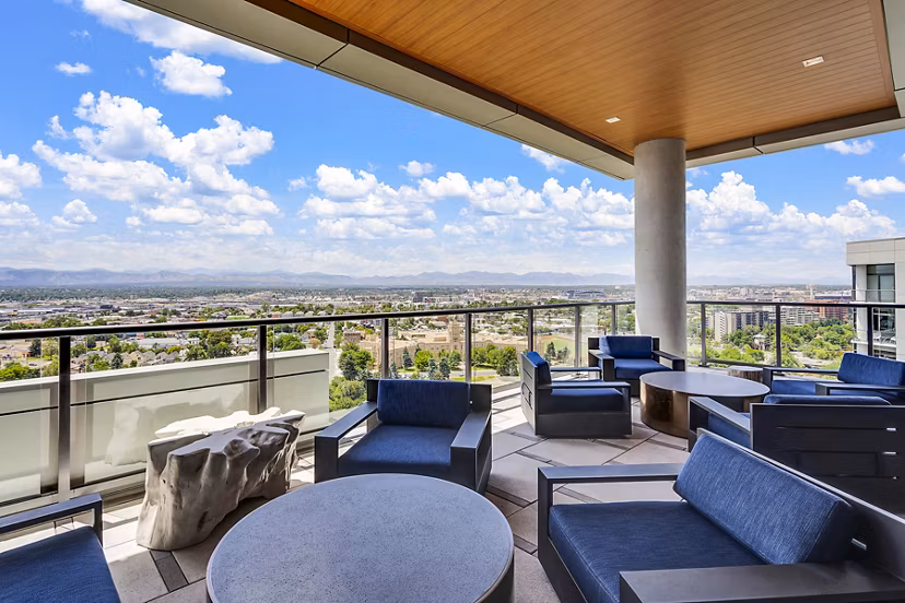 Rooftop patio with modern furniture and scenic city views at Parq on Speer luxury apartments in downtown Denver