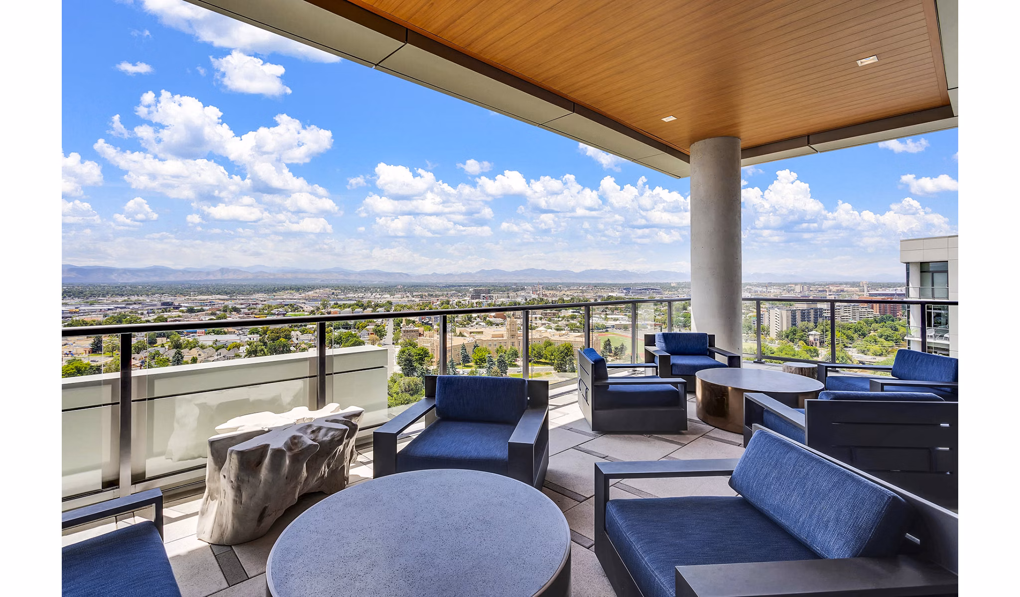 Rooftop patio with modern furniture and scenic city views at Parq on Speer luxury apartments in downtown Denver