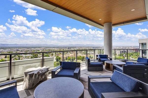 Rooftop patio with modern furniture and scenic city views at Parq on Speer luxury apartments in downtown Denver