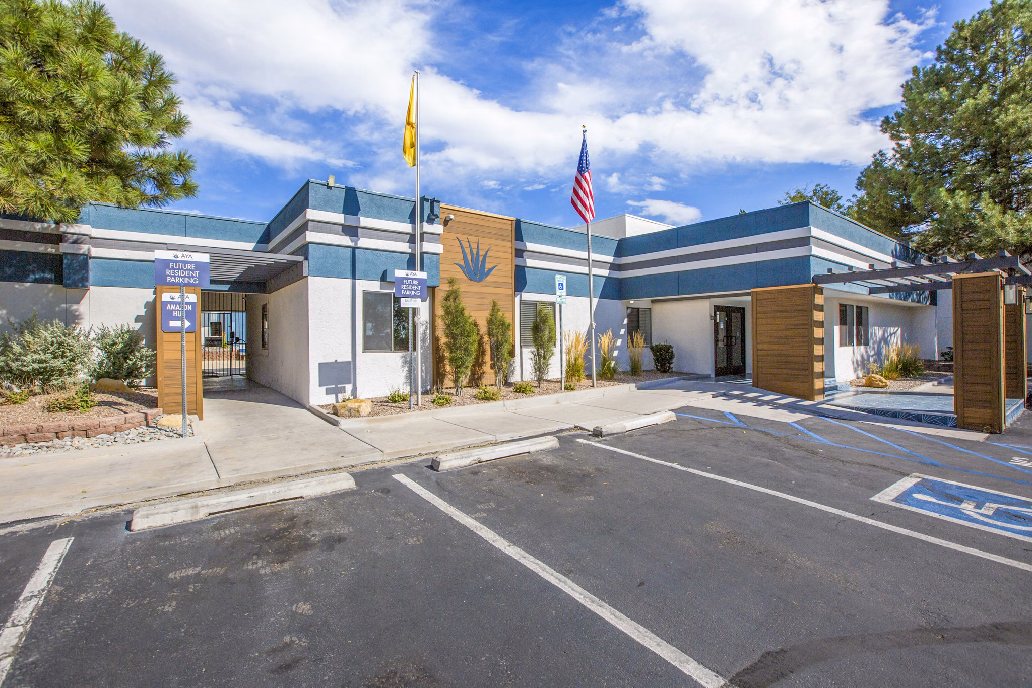 Modern clubhouse and leasing office at AYA ABQ Apartments with stylish seating and vibrant decor