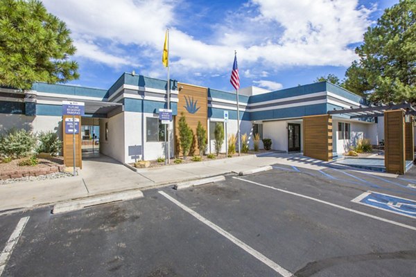 Modern clubhouse and leasing office at AYA ABQ Apartments with stylish seating and vibrant decor