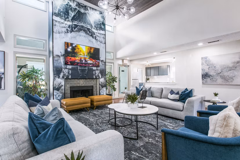 Clubhouse lobby featuring modern decor and seating at AYA ABQ Apartments