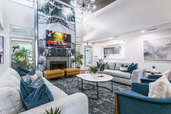 Clubhouse lobby featuring modern decor and seating at AYA ABQ Apartments