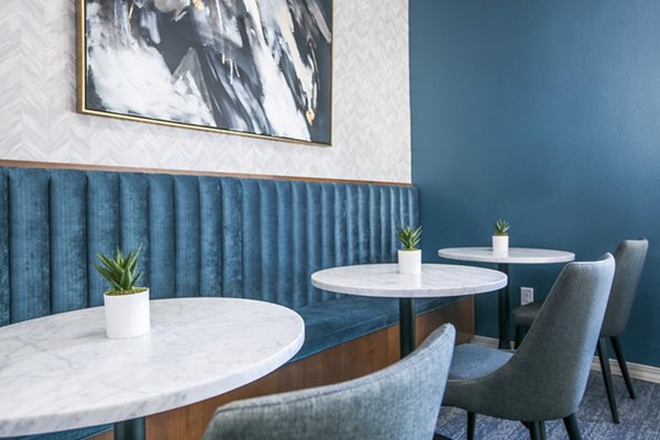 Modern clubhouse/lobby featuring stylish seating and elegant lighting at AYA ABQ Apartments