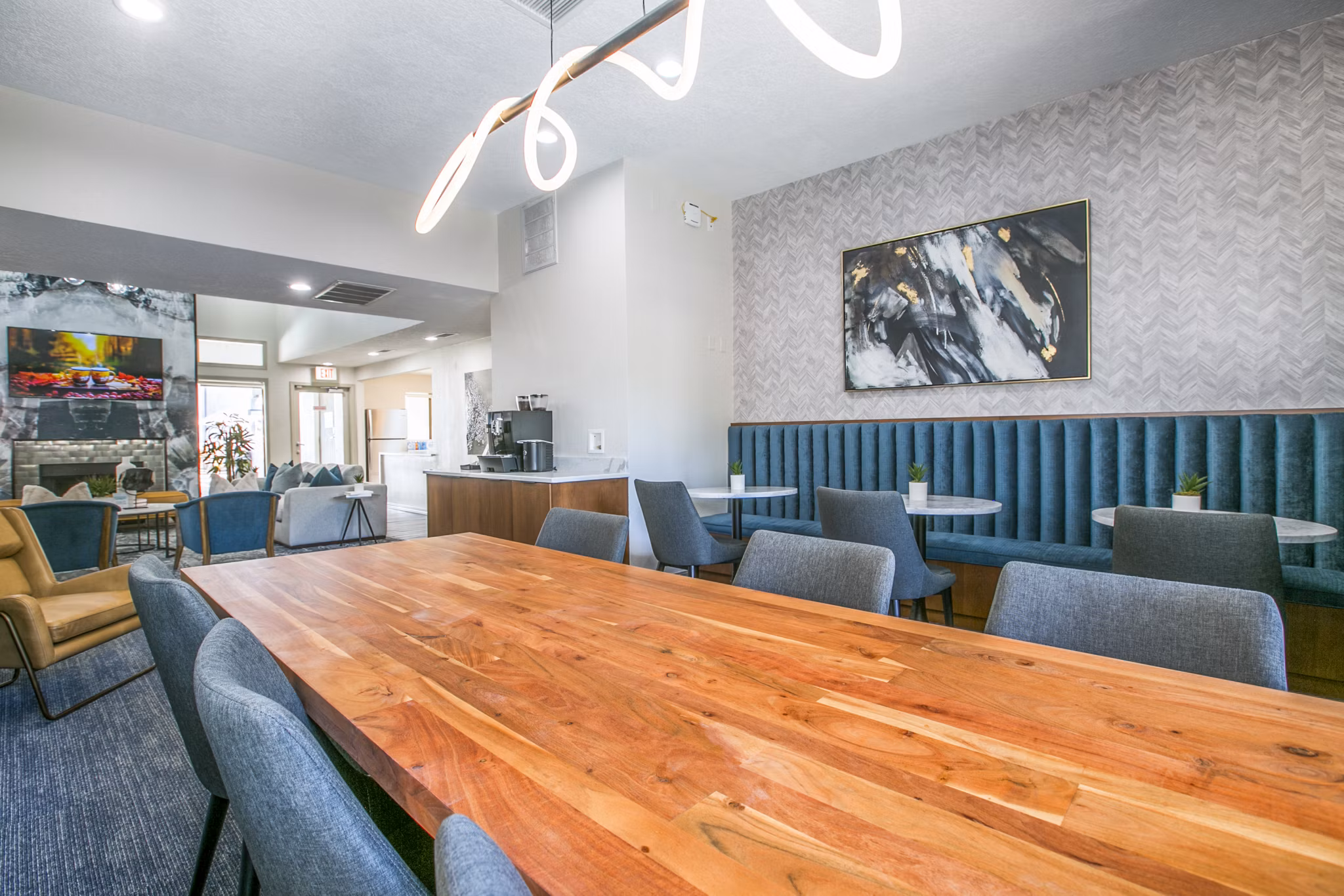 AYA ABQ Apartments: Modern clubhouse lobby with stylish seating and bright lighting in Greystar luxury apartments