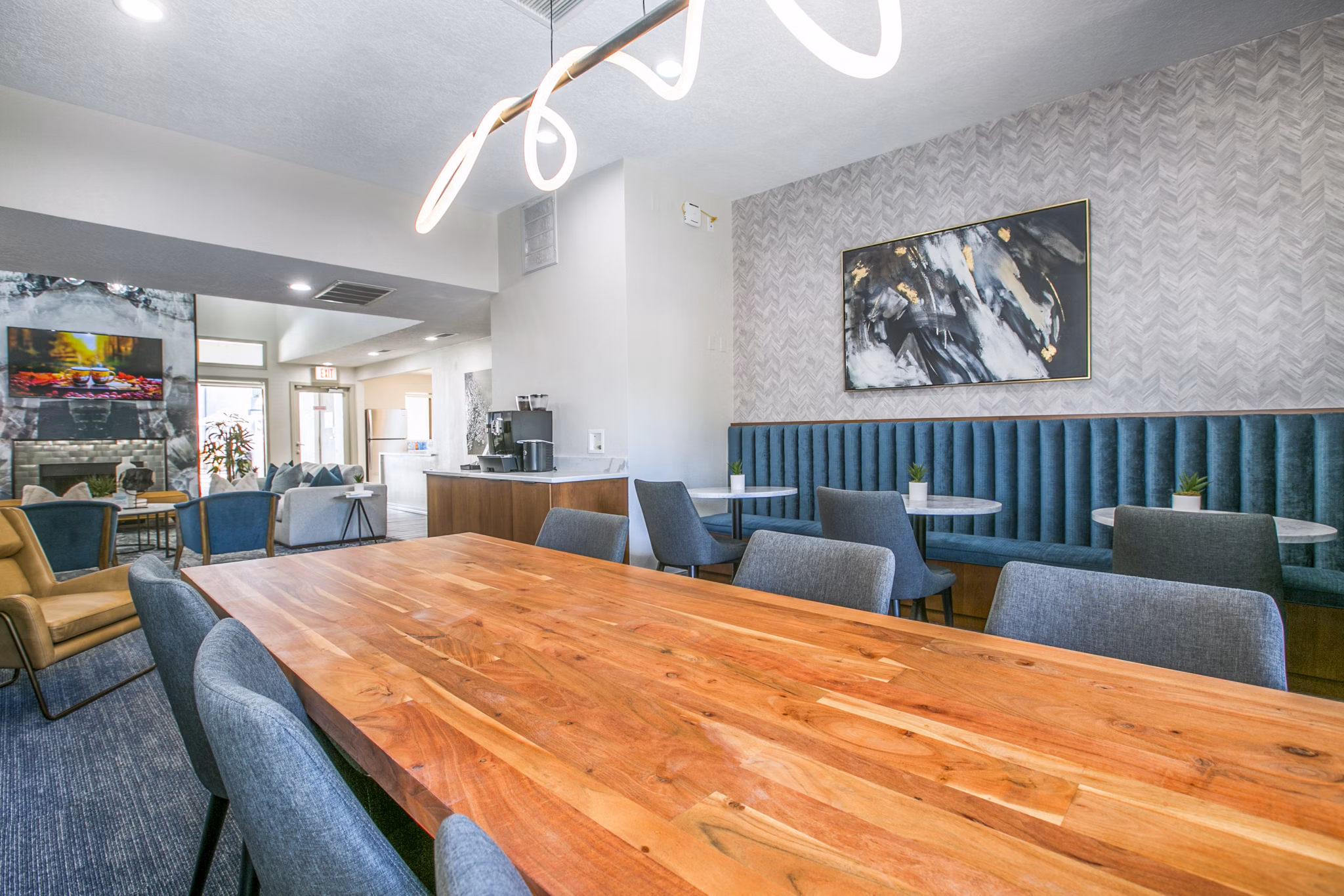 AYA ABQ Apartments: Modern clubhouse lobby with stylish seating and bright lighting in Greystar luxury apartments