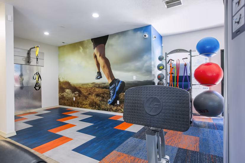 Fitness center with modern equipment at AYA ABQ Apartments, offering residents a comprehensive workout space for active lifestyles