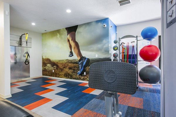 Fitness center with modern equipment at AYA ABQ Apartments, offering residents a comprehensive workout space for active lifestyles