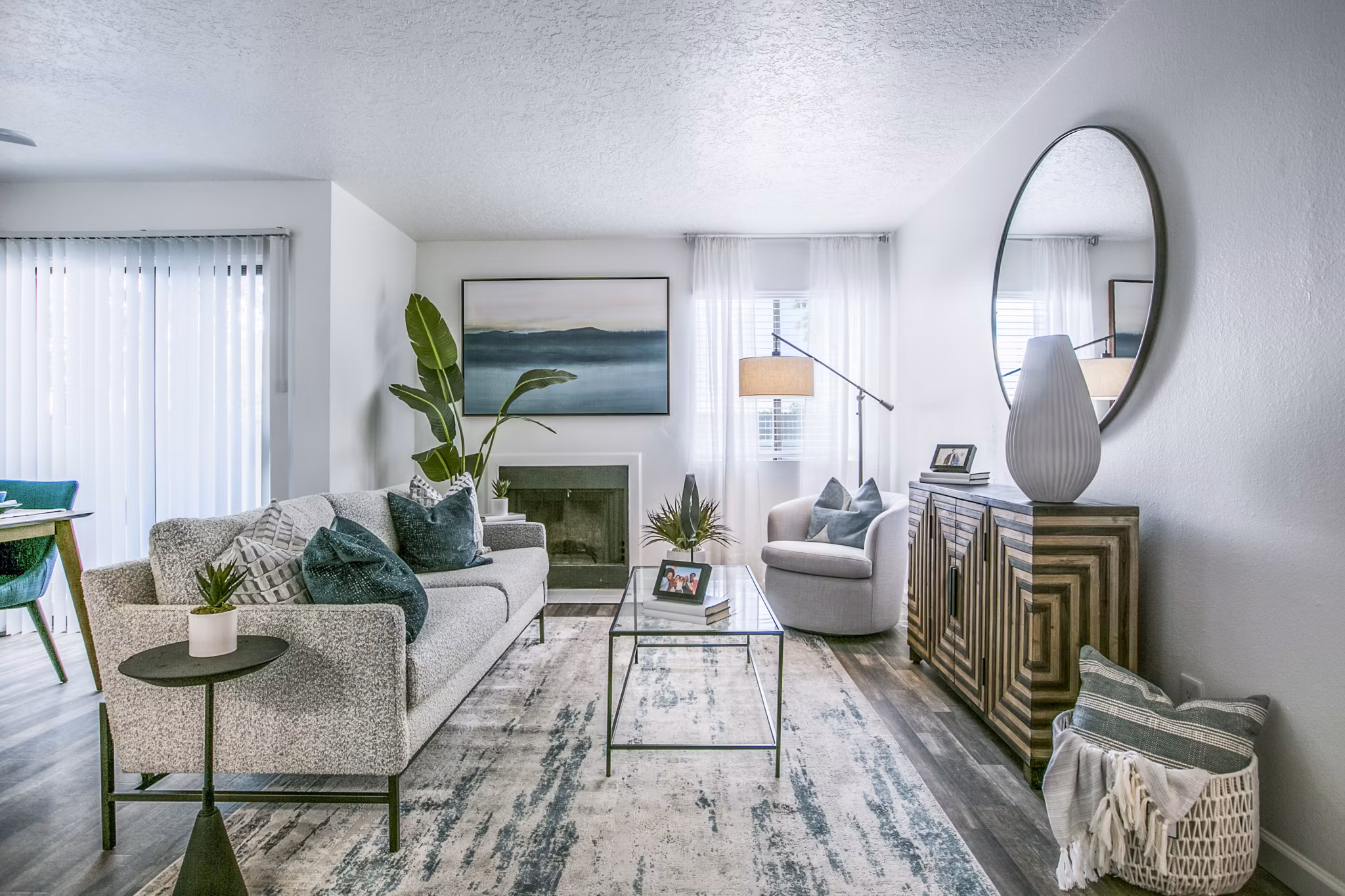Spacious living room with modern decor and natural light in AYA ABQ Apartments