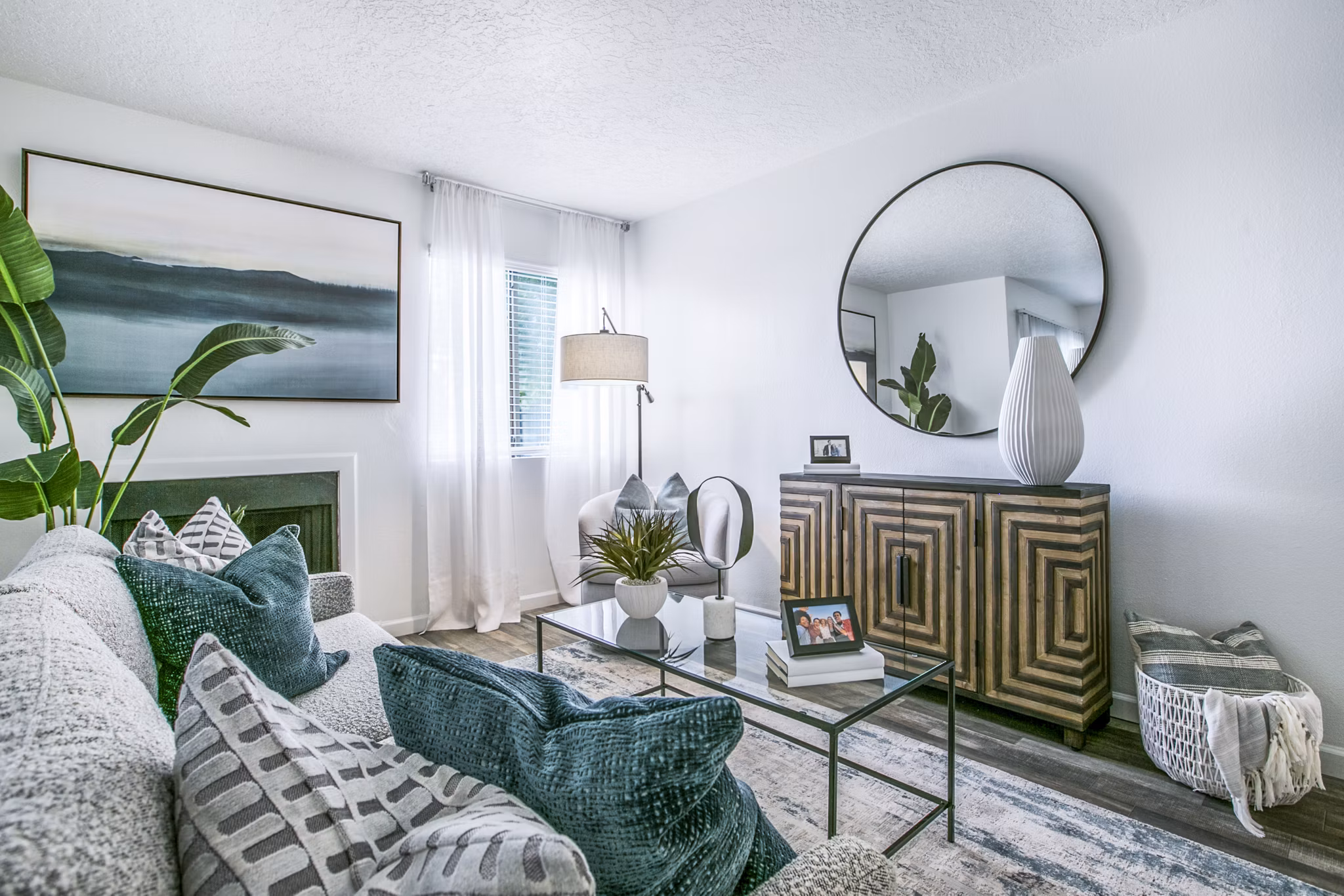 Contemporary living room featuring elegant decor and natural light at AYA ABQ Apartments