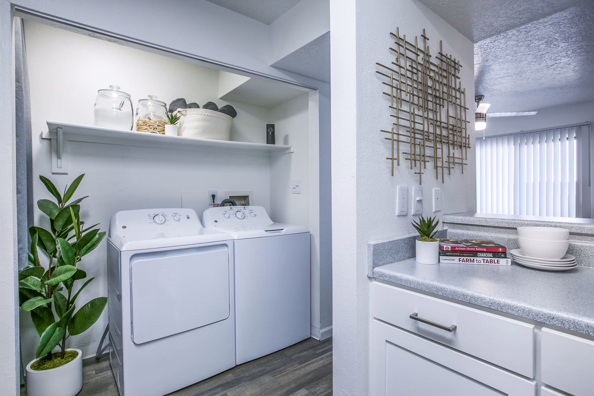 Laundry room with state-of-the-art appliances at AYA ABQ Apartments