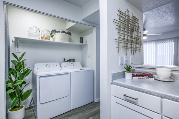 Laundry room with state-of-the-art appliances at AYA ABQ Apartments