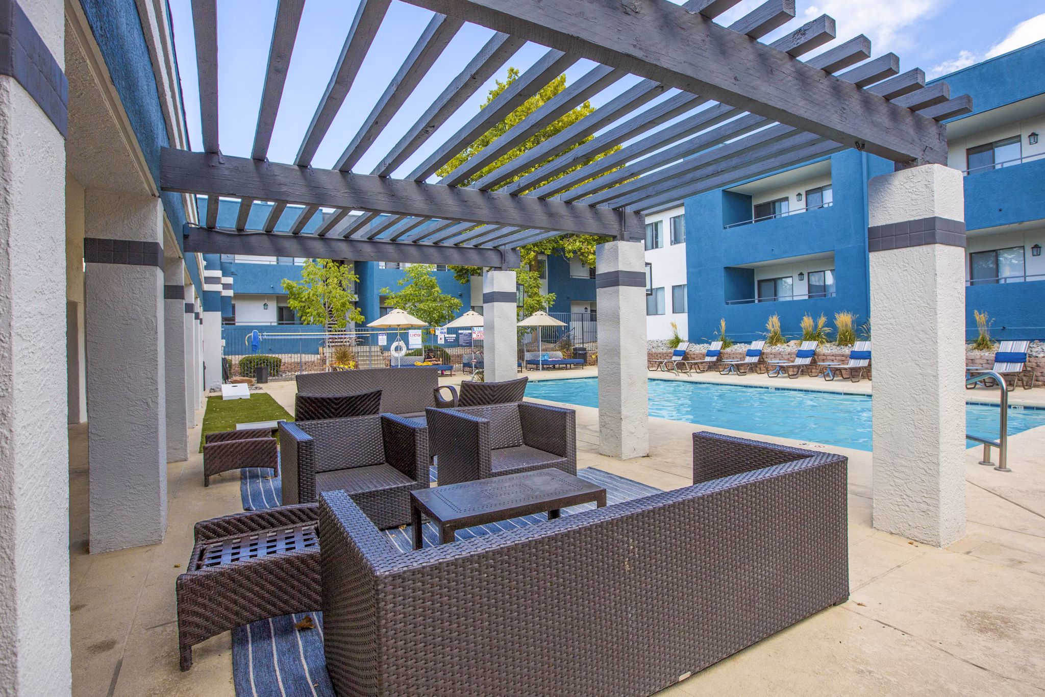 Outdoor grill area on a furnished patio at AYA ABQ Apartments