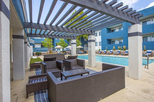 Outdoor grill area on a furnished patio at AYA ABQ Apartments