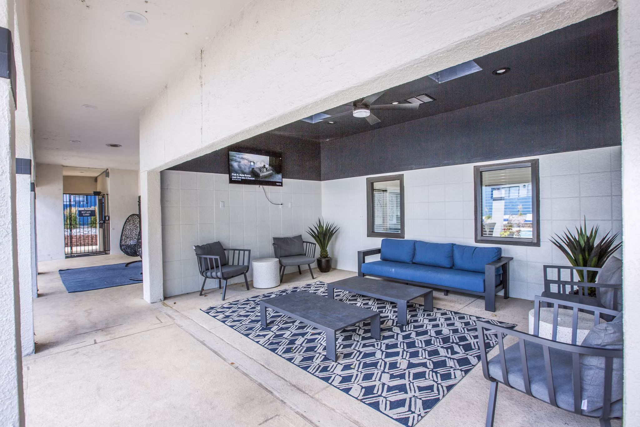 Outdoor grill patio area with modern seating at AYA ABQ Apartments, perfect for gatherings and relaxation in a luxurious setting