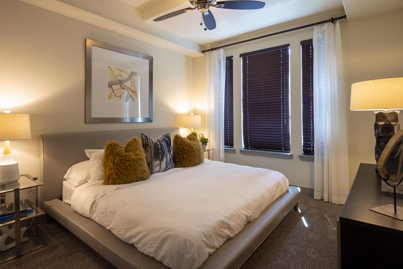 Luxurious bedroom with modern furnishings at 1414 Texas Downtown Apartments in Houston